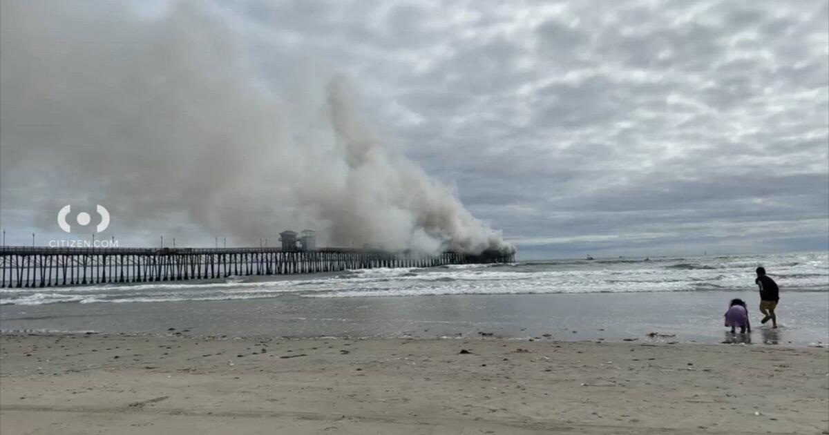 Firefighters respond to flames engulfing Oceanside pier.