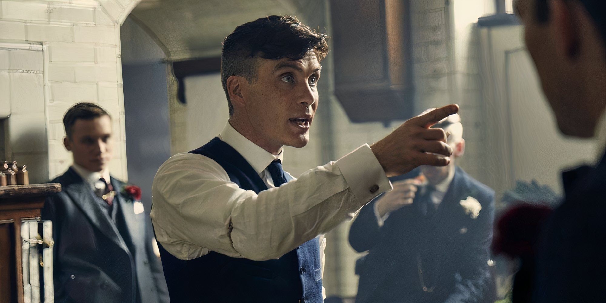 Cillian Murphy as Thomas Shelby, pointing at a man in Peaky Blinders