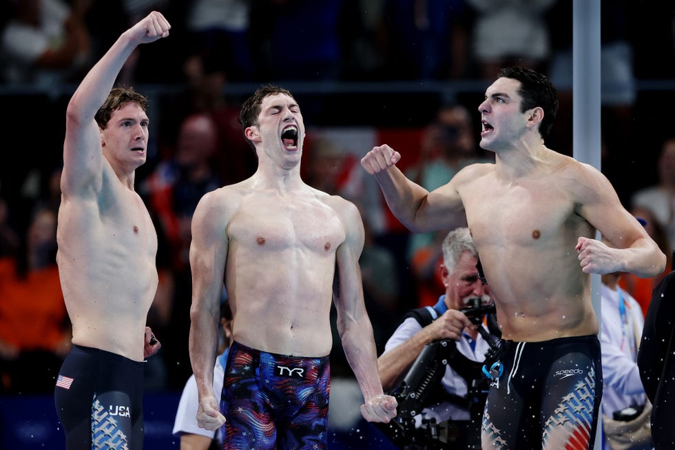 Nanterre, France July 27: Chris Guiliano, Hunter Armstrong, and Jack Alexy of Team United States celebrate after winning gold in the men's 4x100m freestyle relay final on day one of the Olympic Games Paris 2024 at Paris La Defense Arena on July 27, 2024 in Nanterre, France (Photo by Sarah Stier/Getty Images)