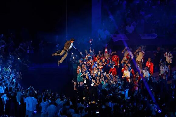 Tom Cruise descends into the stadium during the closing ceremony for the Paris 2024 Olympic Summer Games at Stade de France.