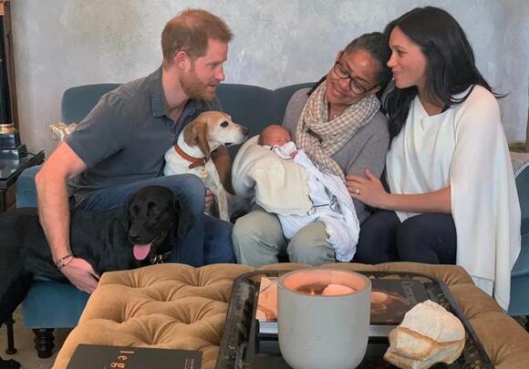 Meghan's mother Doria Ragland cuddles her grandson Prince Archie in 2019