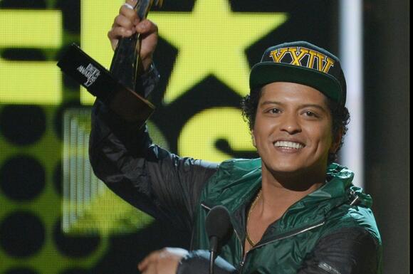 Bruno Mars accepts the award for Best Male R&B/Pop Artist during the BET Awards at Microsoft Theater in Los Angeles in 2017