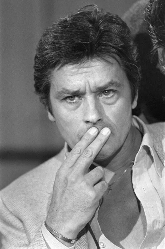 Alain Delon on Oct. 28, 1980, making a TV appearance on TF1 in Paris to promote his new film 'Trois hommes à abattre.' 