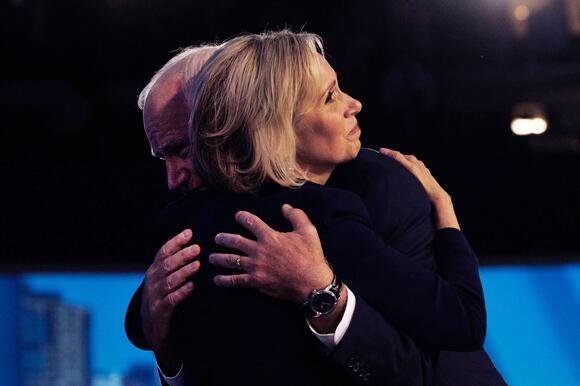 Tim Walz hugs his wife, Gwen Walz