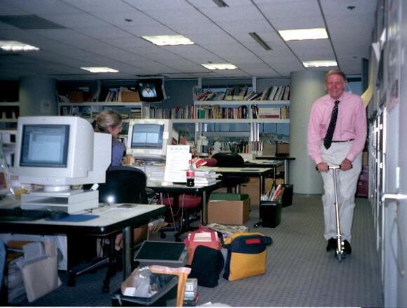 Executive Editor Bob Dubill rides a Razor scooter through the Life Department at USA TODAY. Mike Tsukamoto