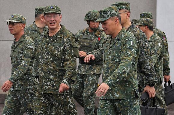 Taiwanese defence minister Wellington Koo inspects troops