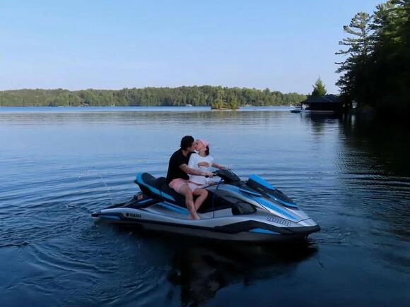 The pair looked loved-up as they posed on a jet ski