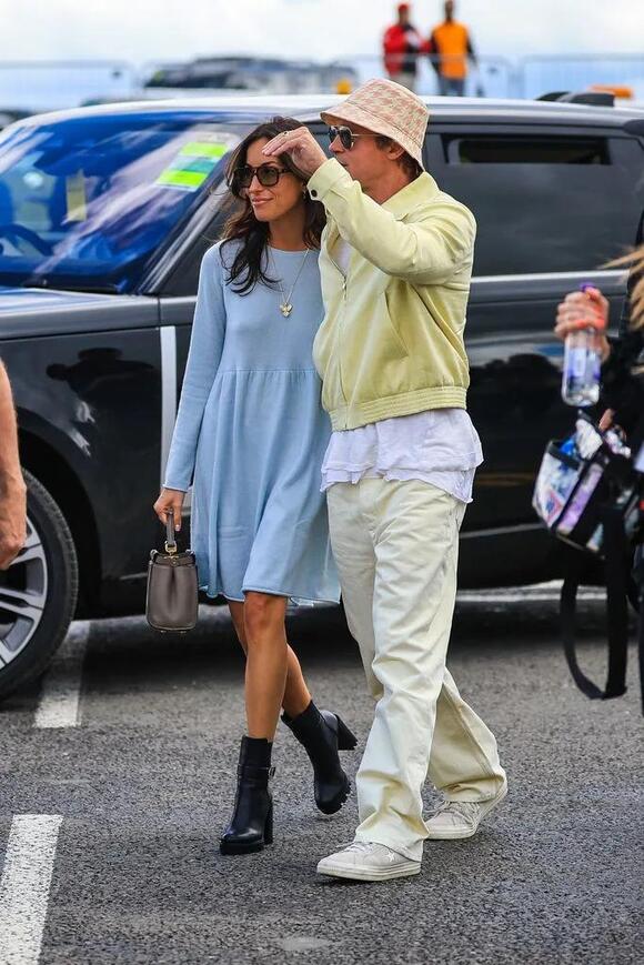 Brad arrives in the paddock with girlfriend Ines during the F1 Grand Prix of Great Britain