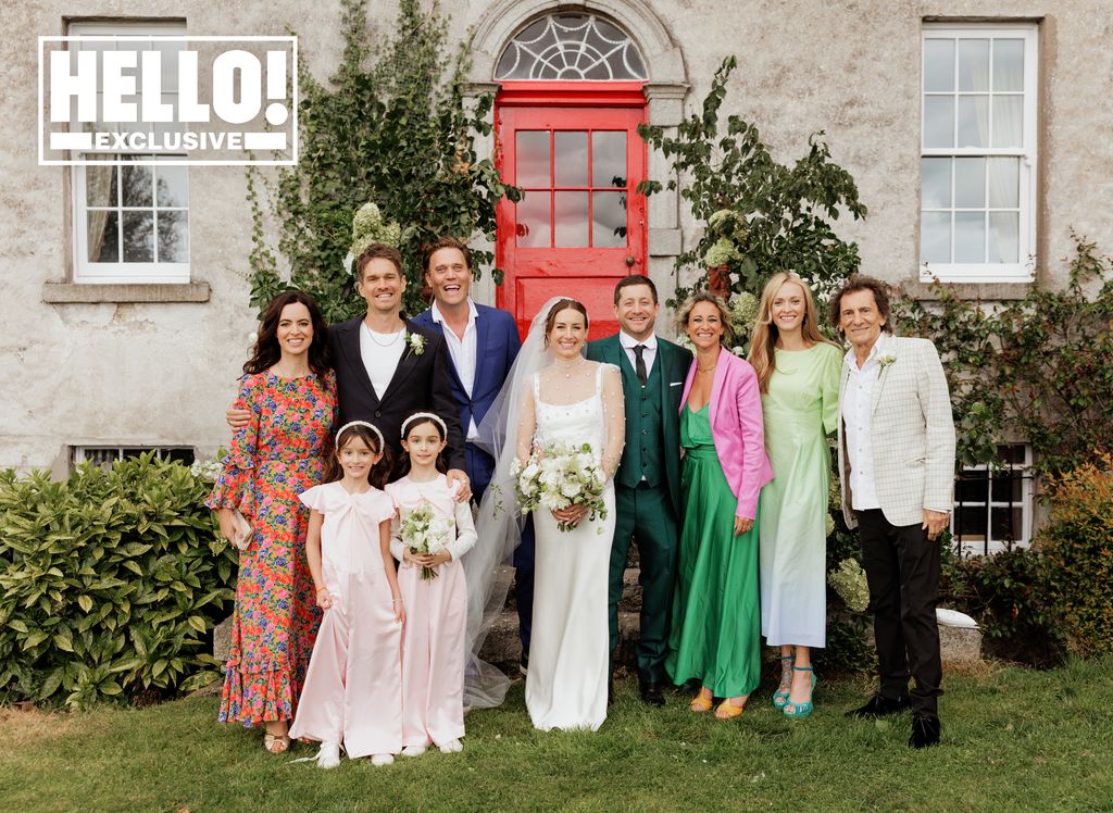 Tyrone Wood and Faye Harris with their family on their wedding day