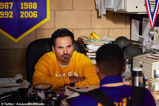 Michael Peña plays Robles' high school wrestling coach Bobby Williams