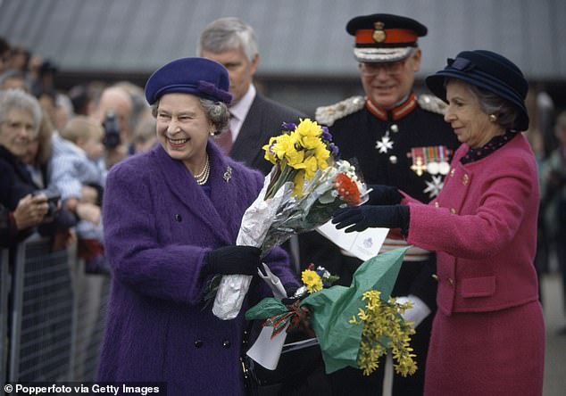 Virginia 'Ginny' Ryan was the first American to have served as a lady-in-waiting to the late Queen (Pictured: right with Queen Elizabeth II in 1992)