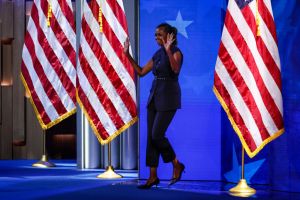 CHICAGO, ILLINOIS - AUGUST 20: Former first lady Michelle Obama arrives to speak on stage during the second day of the Democratic National Convention at the United Center on August 20, 2024 in Chicago, Illinois. Delegates, politicians, and Democratic Party supporters are gathering in Chicago, as current Vice President Kamala Harris is named her party's presidential nominee. The DNC takes place from August 19-22. (Photo by Chip Somodevilla/Getty Images)