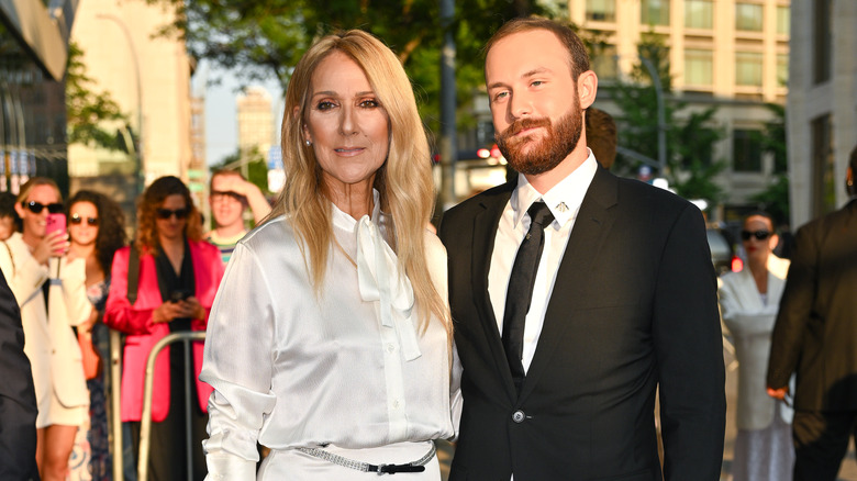 René-Charles Angélil and Celine Dion posing with a crowd