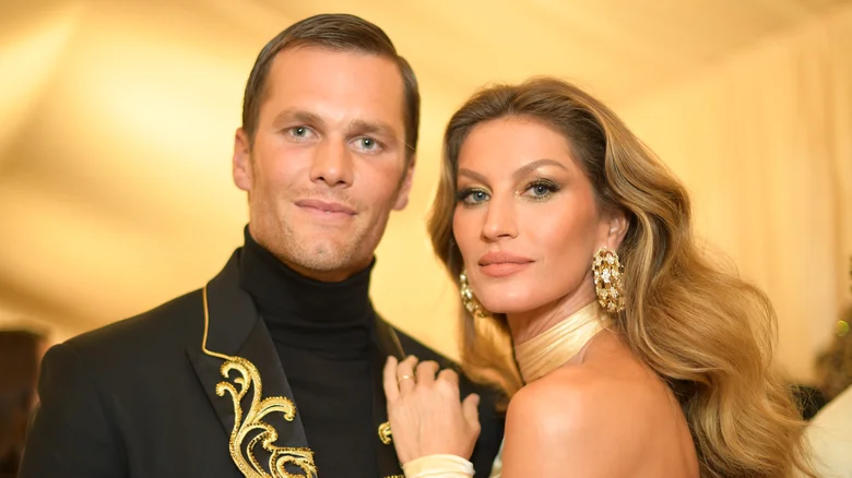 Gisele Bundchen and Tom Brady posing at an event