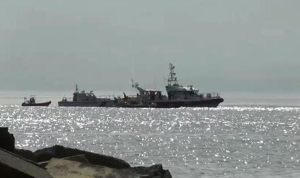 Italian Coast Guard vessels conducting recovery operations