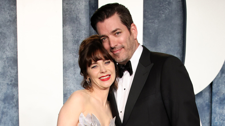 Zooey Deschanel and Jonathan Scott heads together