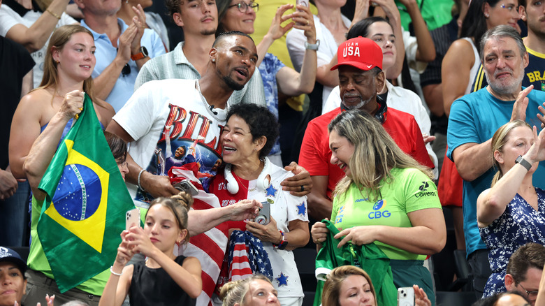 Jonathan Owens hugging Nellie Biles