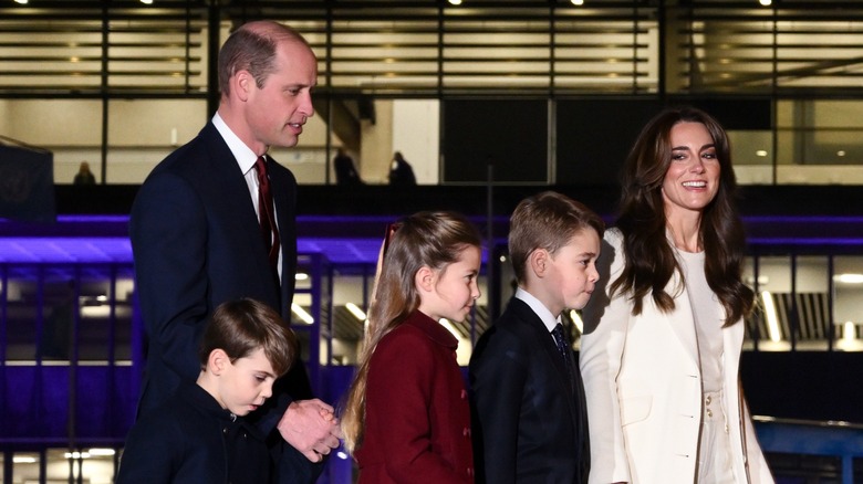 Kate Middleton and Prince William walking with their kids