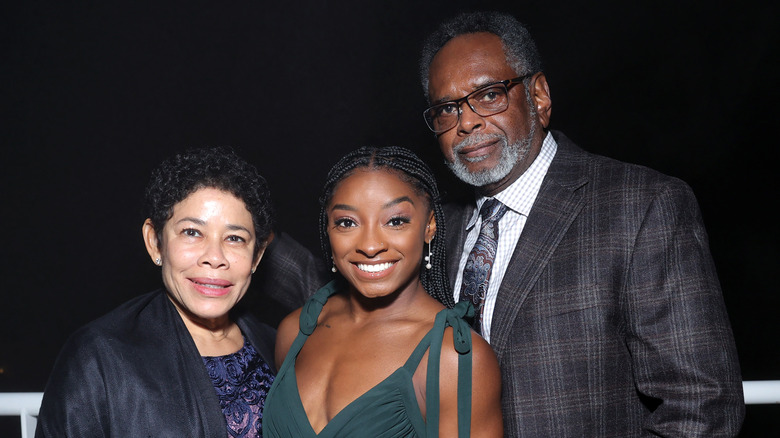 Nellie, Simone, and Ronald Biles smiling