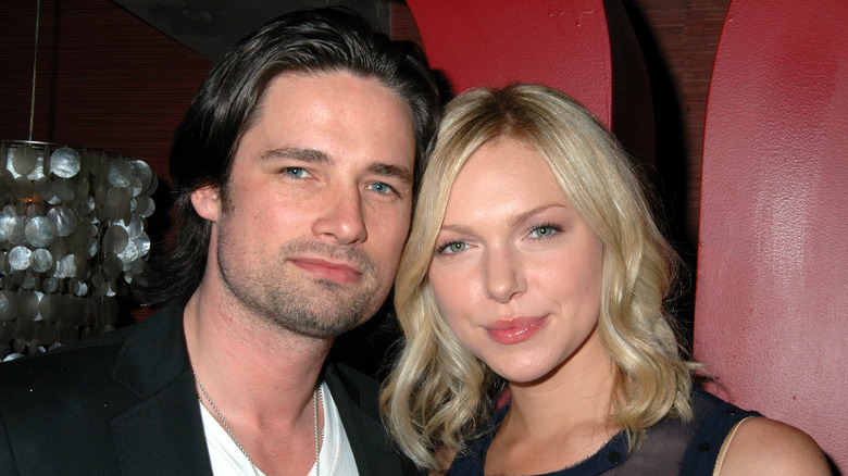 Warren Christie posing with Laura Prepon