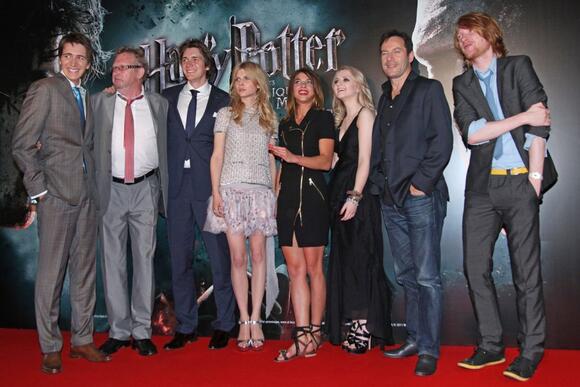 Left to right, James Phelps, Mark Williams, Oliver Phelps, Clemence Poesy, Natalia Tena, Evanna Lynch, Jason Isaacs and Domhnall Gleeson arrive at the French premiere of the film 'Harry Potter and the Deathly Hallows: Part 2' in Paris in 2011