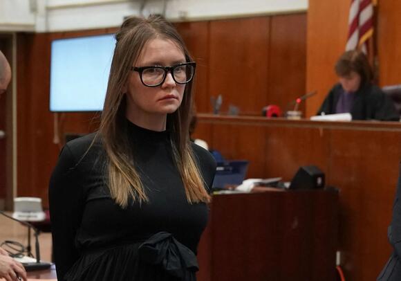 Anna Sorokin is led away after being sentenced.