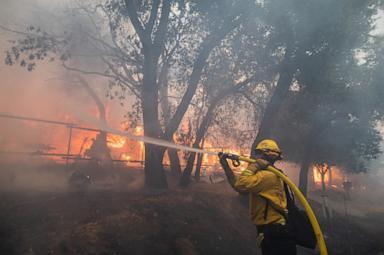 Firefighter battles flames