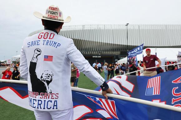 Trump supporters unfurling flag