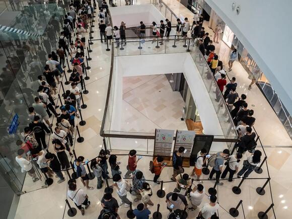 Customers lining up at an Apple store in China