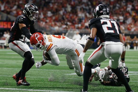 JuJu Smith-Schuster dives into the end zone after a reception for a touchdown.