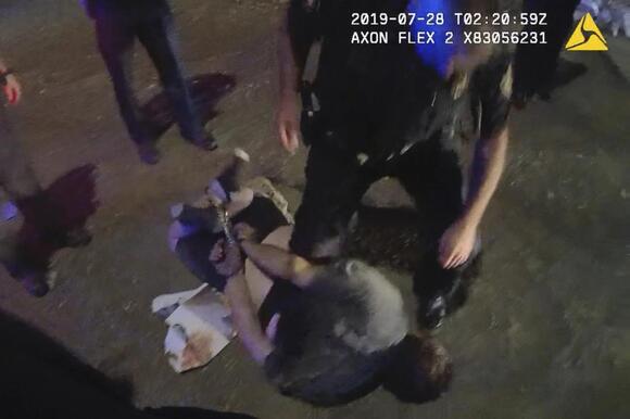 Body-camera video shows cuffs on the wrists and ankles used to restrain an individual in Knoxville, Tennessee.